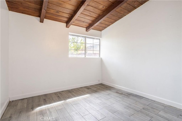 unfurnished room featuring wood ceiling, vaulted ceiling with beams, baseboards, and wood finished floors