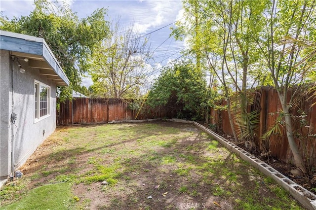 view of yard featuring a fenced backyard