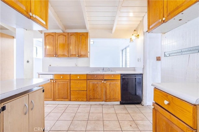 kitchen with beam ceiling, light tile patterned floors, light countertops, a sink, and dishwasher