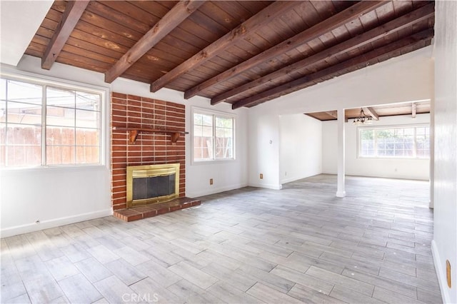 unfurnished living room featuring vaulted ceiling with beams, wooden ceiling, wood finished floors, baseboards, and a brick fireplace