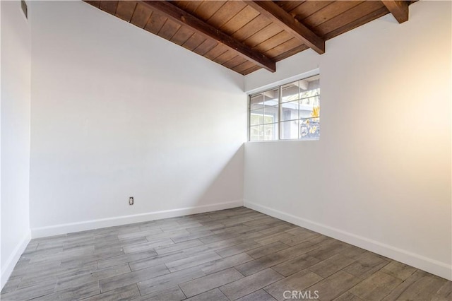 unfurnished room featuring lofted ceiling with beams, wooden ceiling, wood finished floors, and baseboards