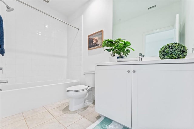 bathroom featuring tile patterned floors, visible vents, toilet, bathtub / shower combination, and vanity