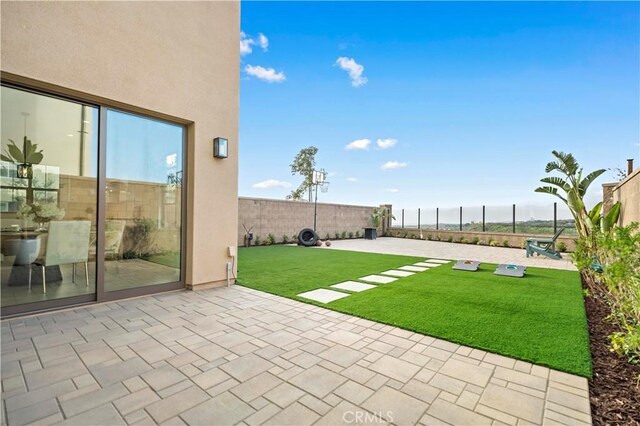 view of yard with a fenced backyard and a patio area