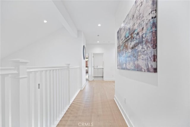 corridor featuring lofted ceiling with beams, recessed lighting, light wood-style floors, and baseboards