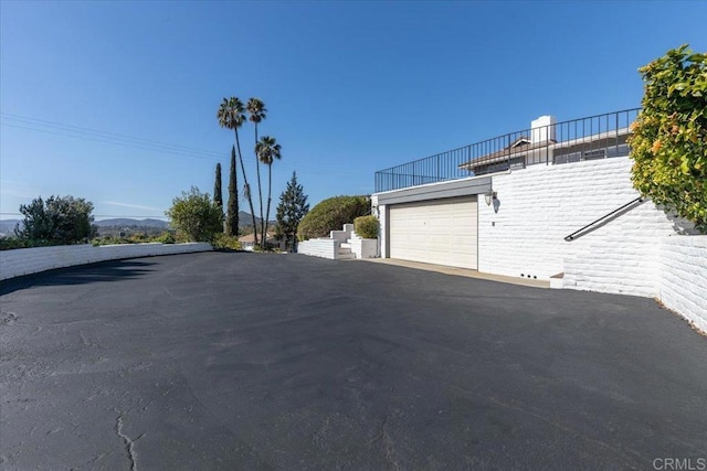 view of street featuring driveway