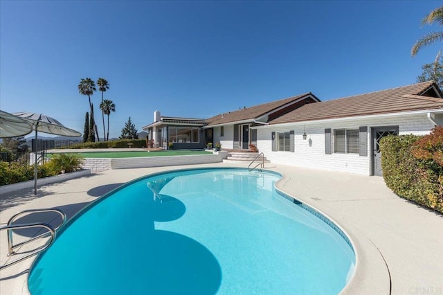 pool featuring a patio area