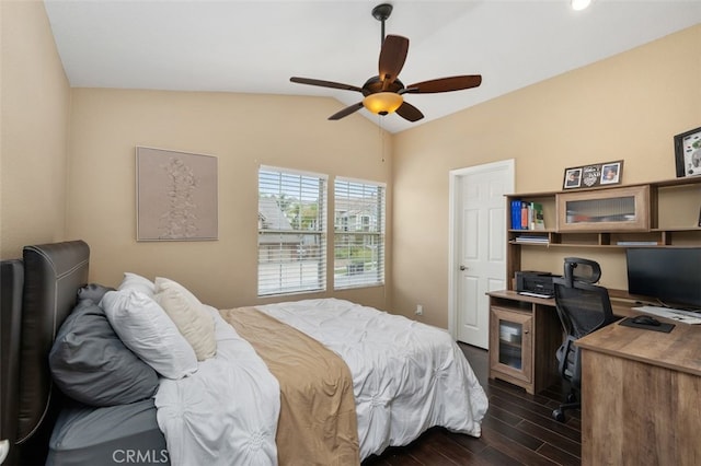 bedroom with lofted ceiling, dark wood-style flooring, and a ceiling fan