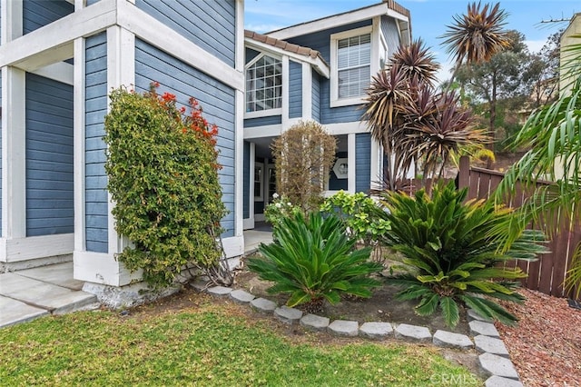 view of property exterior featuring fence