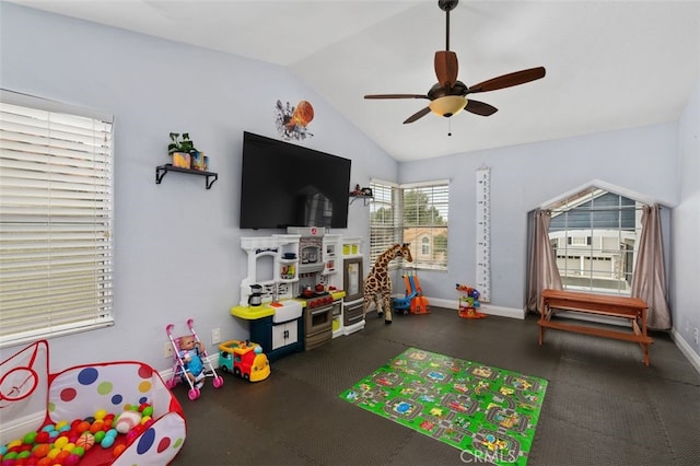 rec room featuring lofted ceiling, ceiling fan, and baseboards