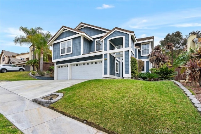 view of front of home featuring concrete driveway, an attached garage, fence, and a front yard