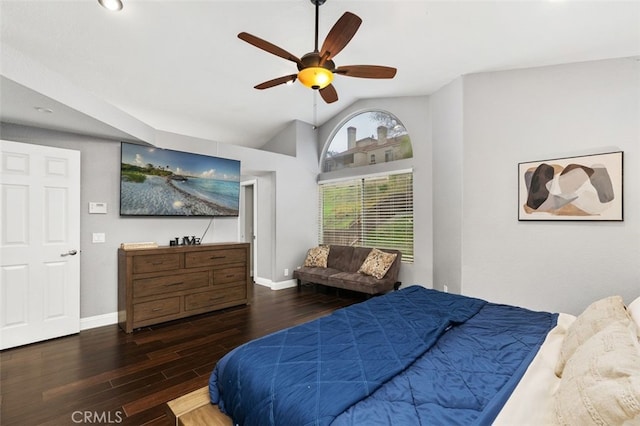 bedroom featuring lofted ceiling, ceiling fan, baseboards, and wood finished floors