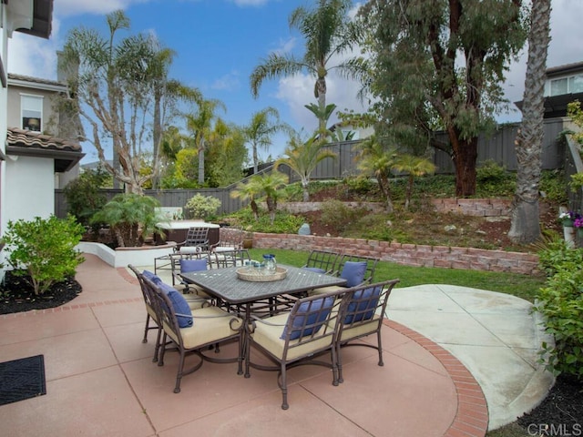 view of patio / terrace with outdoor dining area and a fenced backyard