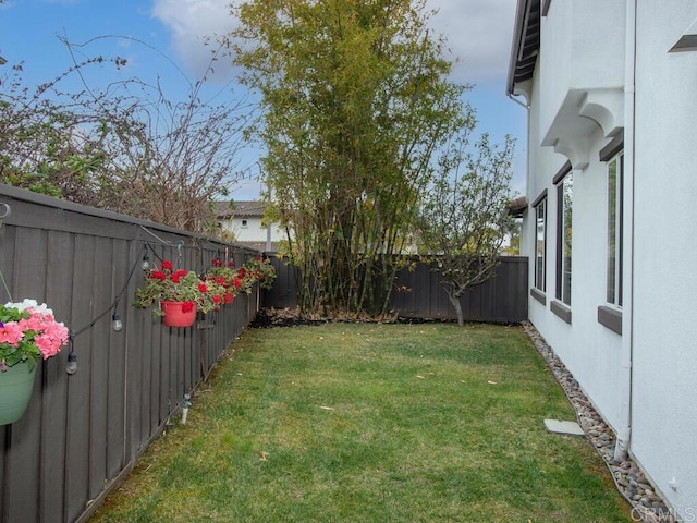 view of yard featuring a fenced backyard