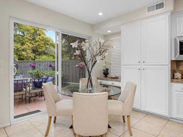 dining area featuring light tile patterned floors, visible vents, and recessed lighting