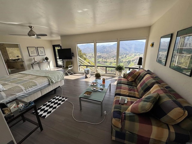bedroom with access to exterior and wood finished floors