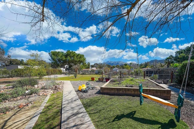 16233 Oakley Rd, Ramona, CA 92065 - view of community with fence, a vegetable garden, a mountain view, and a lawn