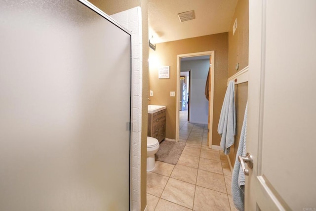 16233 Oakley Rd, Ramona, CA 92065 - bathroom featuring tile patterned flooring, toilet, visible vents, vanity, and a stall shower