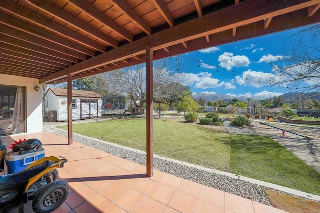 16233 Oakley Rd, Ramona, CA 92065 - view of patio with an outbuilding and a mountain view