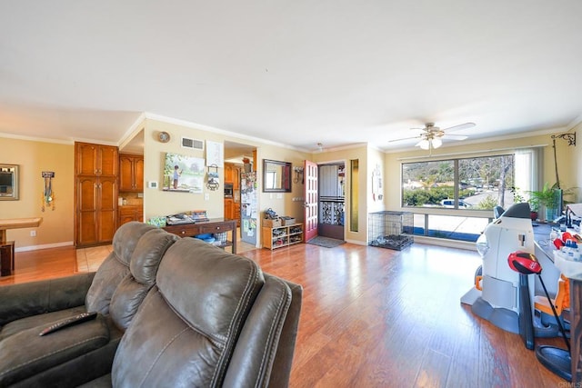 16233 Oakley Rd, Ramona, CA 92065 - living area featuring ceiling fan, visible vents, baseboards, light wood-type flooring, and crown molding