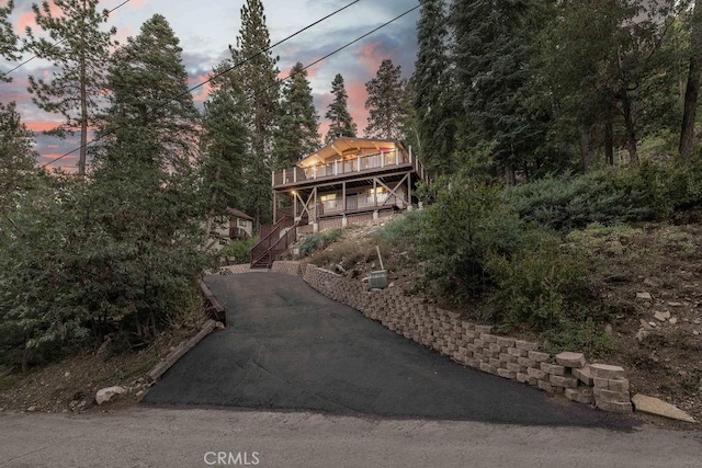 exterior space with driveway and stairway