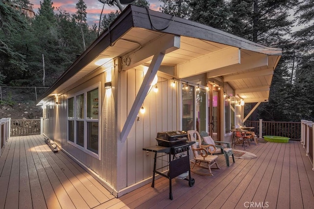 wooden terrace with area for grilling