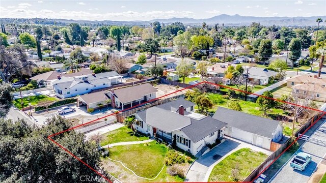 bird's eye view featuring a residential view and a mountain view