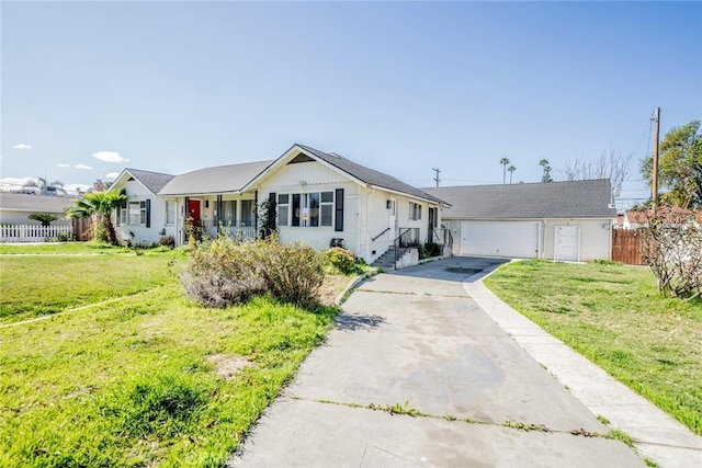 ranch-style house featuring a garage, fence, a front lawn, and an outdoor structure