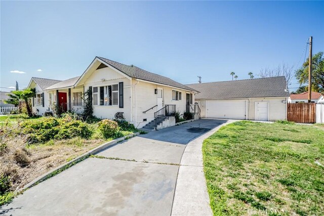 single story home with a garage, fence, and a front lawn