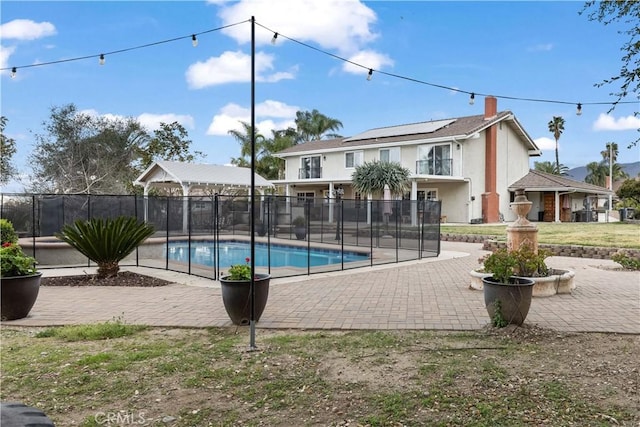 view of pool with a patio area, fence, and a fenced in pool