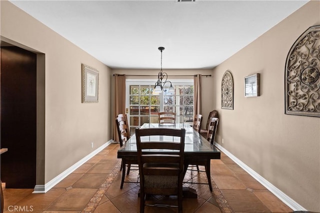 dining area with tile patterned flooring and baseboards