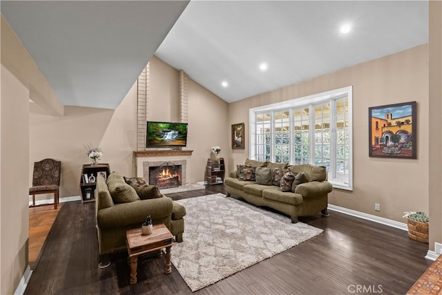 living room featuring recessed lighting, dark wood-type flooring, baseboards, vaulted ceiling, and a brick fireplace