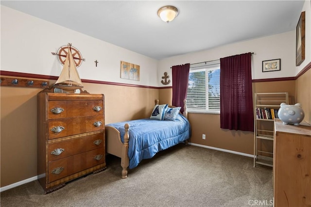 bedroom with carpet floors and baseboards