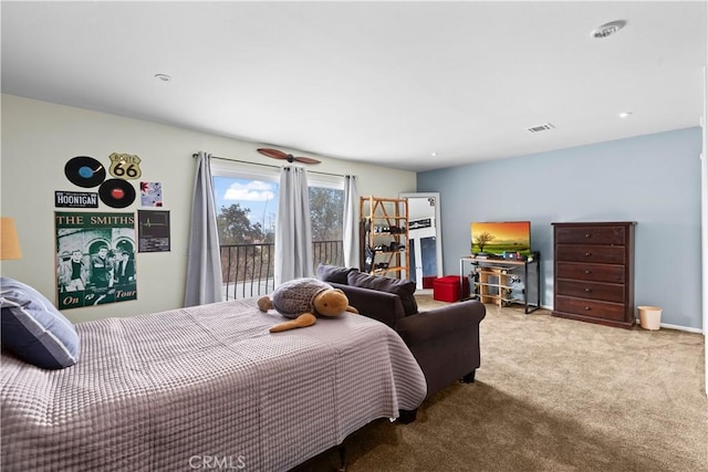 carpeted bedroom featuring visible vents