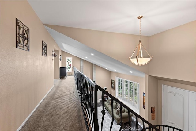 corridor featuring carpet floors, recessed lighting, vaulted ceiling, an upstairs landing, and baseboards