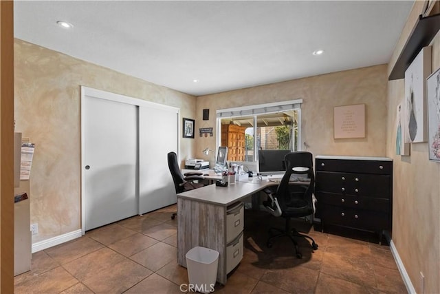 office space with recessed lighting, tile patterned flooring, and baseboards