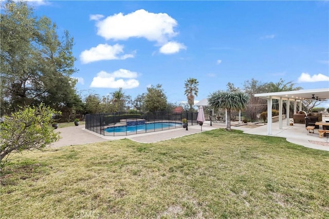 view of yard featuring ceiling fan, a patio area, fence, and a fenced in pool