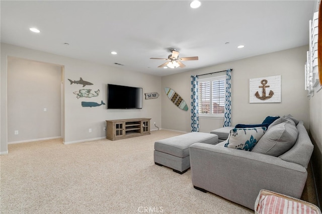 living area featuring carpet, a ceiling fan, and recessed lighting