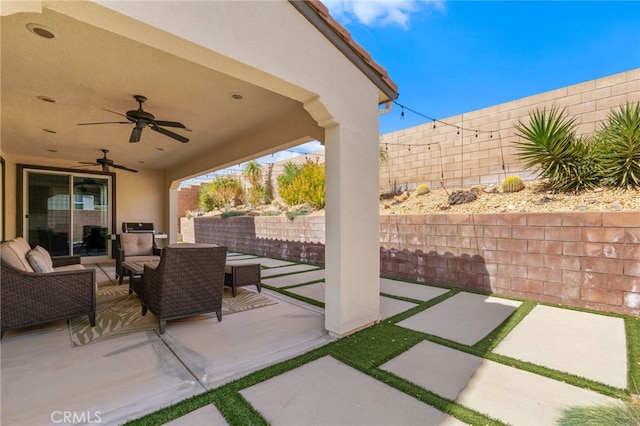 view of patio / terrace with ceiling fan, a fenced backyard, and an outdoor living space