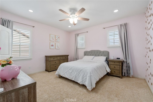 carpeted bedroom featuring ceiling fan, baseboards, and recessed lighting