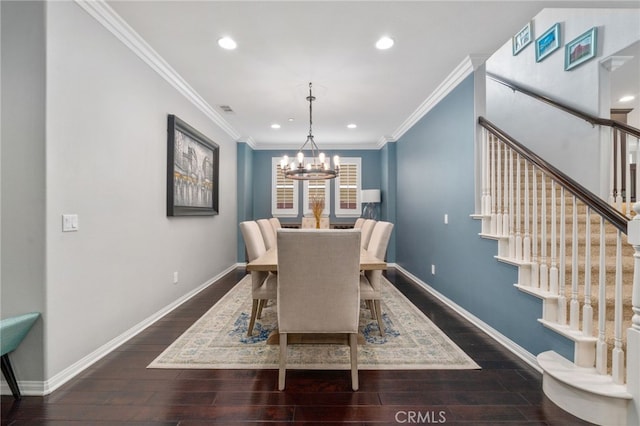 dining area with baseboards, wood finished floors, and ornamental molding