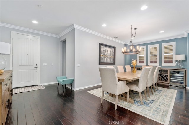 dining room featuring dark wood-style floors, crown molding, recessed lighting, beverage cooler, and baseboards