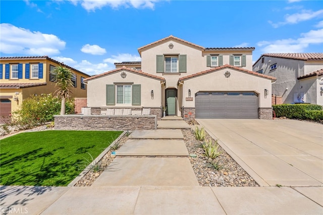 mediterranean / spanish-style home featuring a garage, concrete driveway, stone siding, a front lawn, and stucco siding