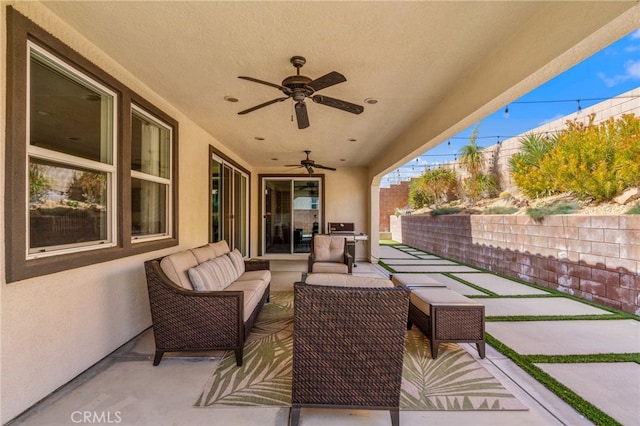 view of patio / terrace with ceiling fan and outdoor lounge area