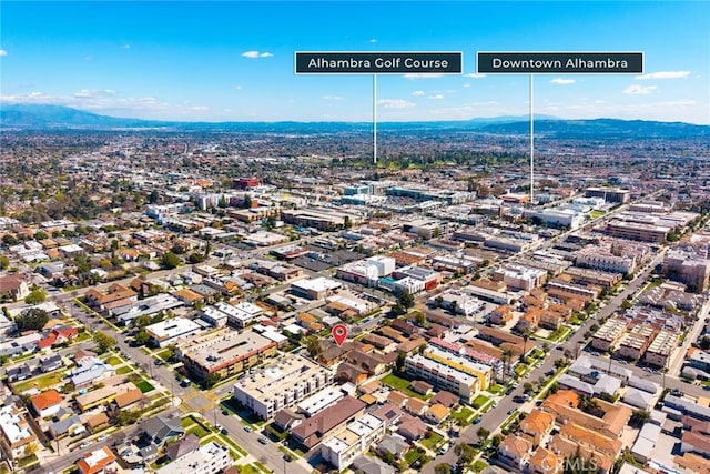 birds eye view of property with a mountain view