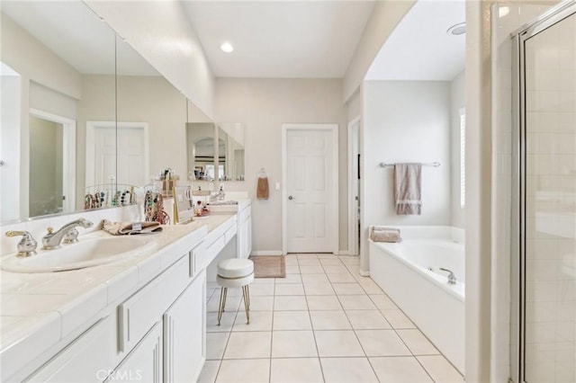 25 Vista Toscana, Lake Elsinore, CA 92532 - bathroom featuring double vanity, a garden tub, a shower stall, and tile patterned floors