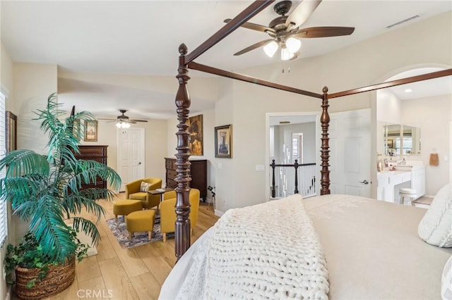 25 Vista Toscana, Lake Elsinore, CA 92532 - bedroom featuring light wood-style floors, vaulted ceiling, a ceiling fan, and connected bathroom