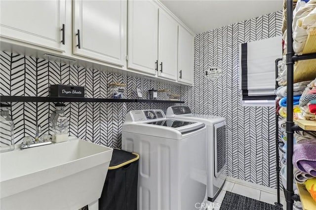 25 Vista Toscana, Lake Elsinore, CA 92532 - laundry area with washing machine and dryer, cabinet space, wallpapered walls, light tile patterned floors, and tile walls