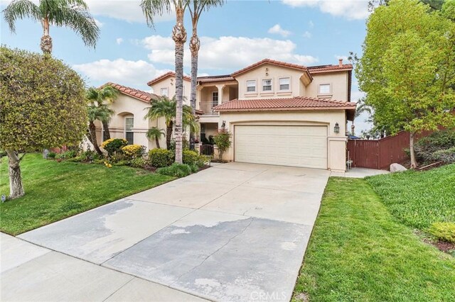 25 Vista Toscana, Lake Elsinore, CA 92532 - mediterranean / spanish-style home with stucco siding, driveway, an attached garage, and a tile roof