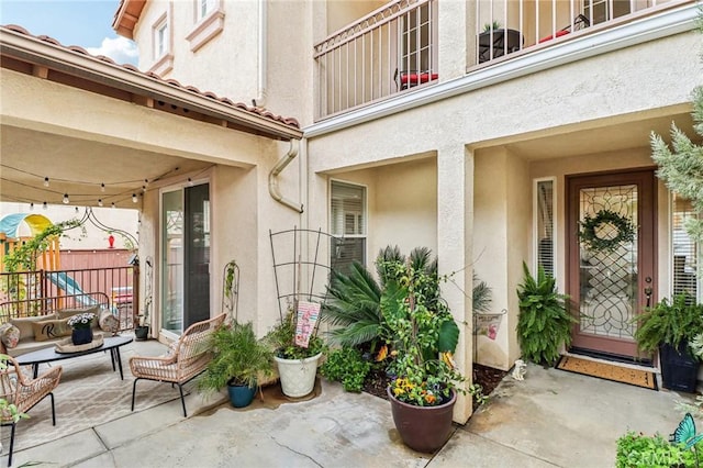 25 Vista Toscana, Lake Elsinore, CA 92532 - doorway to property with stucco siding and a patio