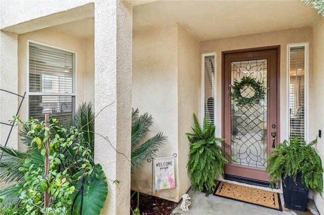 25 Vista Toscana, Lake Elsinore, CA 92532 - view of exterior entry with stucco siding